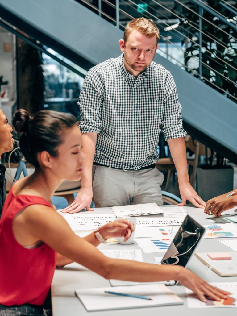 A Man in a Meeting at an Office with his Coworkers